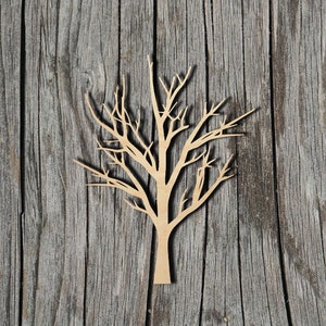 May include: A wooden cutout of a bare tree branch with a brown woodgrain finish. The tree is set against a weathered wood background.