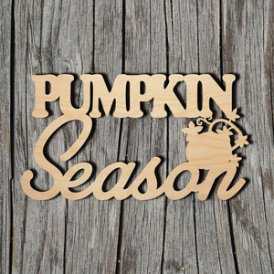 May include: A wooden sign with the words "PUMPKIN Season" cut out in a decorative font. The word "Pumpkin" is in a block font, and "Season" is in a cursive font. A pumpkin and vine design is included.