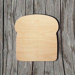 May include: A wooden cutout of a slice of bread, perfect for crafting or decorating.