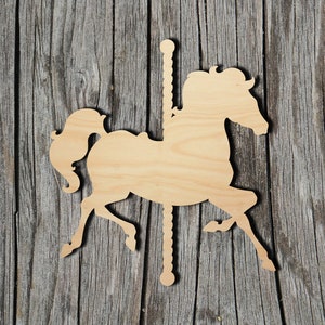 May include: A wooden cutout of a carousel horse, painted in a natural wood color. The horse is in a running pose with its head turned to the side. The cutout is perfect for crafting projects, home decor, or party decorations.