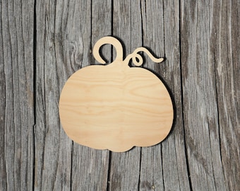 May include: A wooden pumpkin cutout with a simple, hand-drawn stem. The cutout is unpainted and has a natural wood finish.