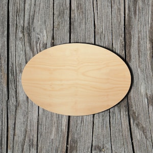 May include: A light brown oval wooden sign with a smooth surface. The sign is on a weathered wooden background.
