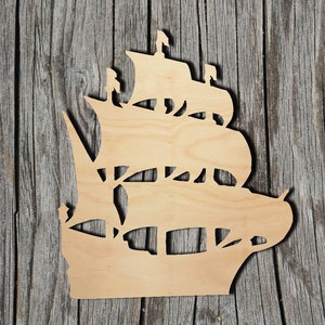 May include: Wooden cutout of a ship with sails, perfect for crafting projects or home decor.