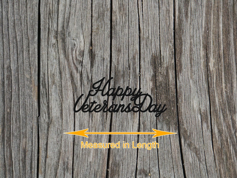 May include: A weathered wooden background with the text "Happy Veterans Day" in black lettering. An orange arrow points to the length of the text, with the words "Measured in Length" below.