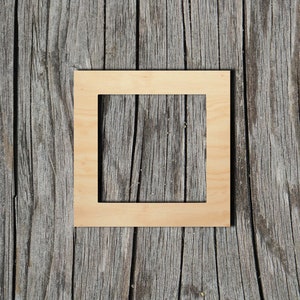 May include: A simple, unfinished wooden picture frame with a natural wood color. The frame is sitting on a weathered wooden surface.