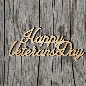 May include: Wooden sign with the text "Happy Veterans Day" in a cursive font, against a woodgrain background.