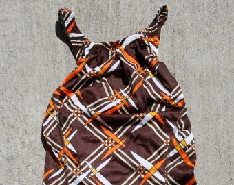 Brown and orphanage geometric print swimsuit.
