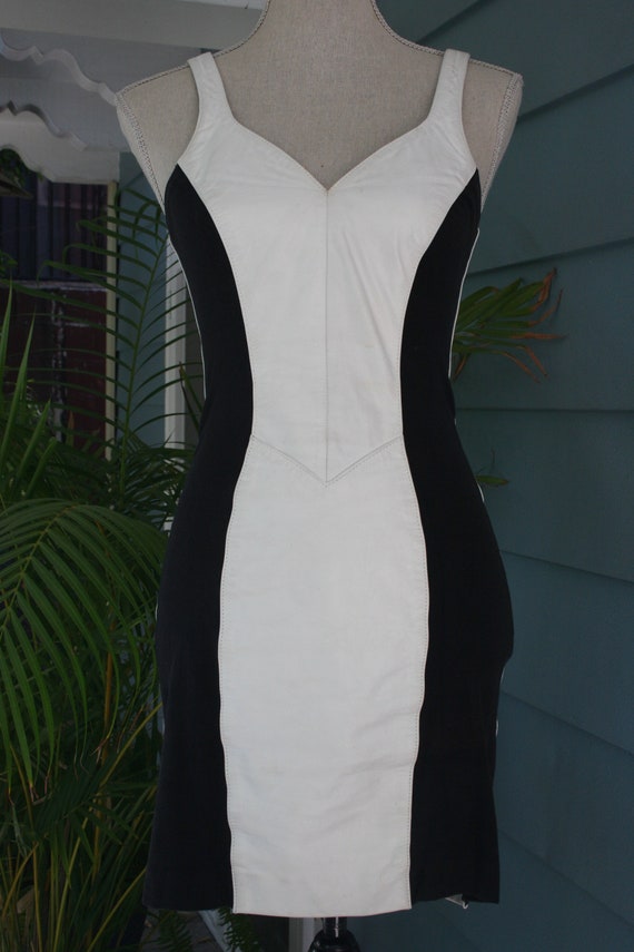 White leather and black jersey bodycon dress.
