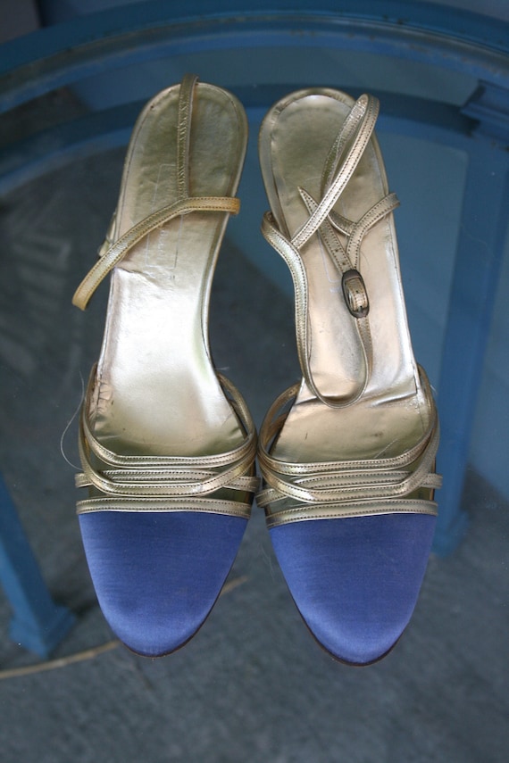 Blue and gold strappy sandals.