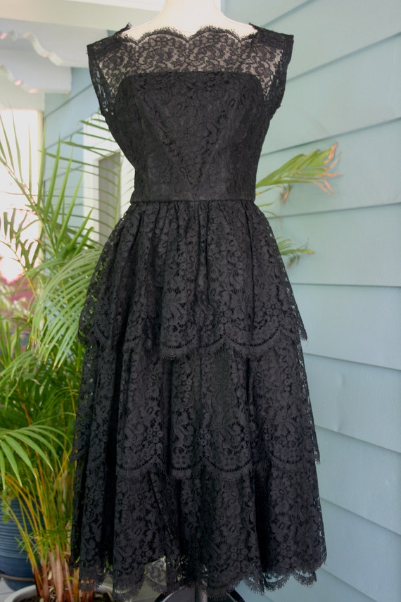 Black tiered lace 50’s evening gown.