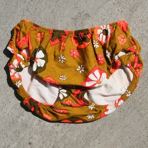 1960&#39;s tan and and fluorescent orange cut-out bikini bottom.