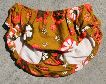 1960's tan and and fluorescent orange cut-out bikini bottom.