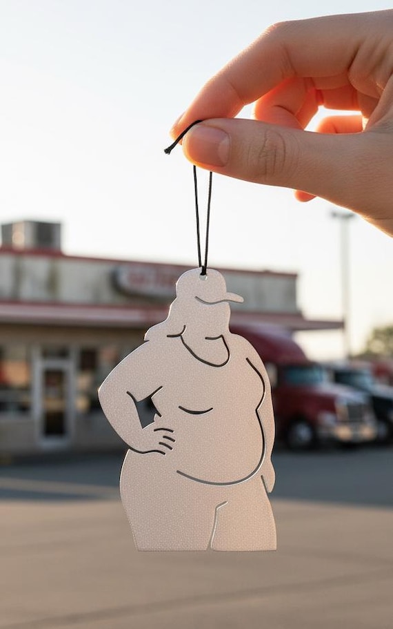 Custom laser-cut or hand-shaped metal art ornament with a trucking theme — the kind of hyper-specific personalized gift that makes a trucker's jaw drop.