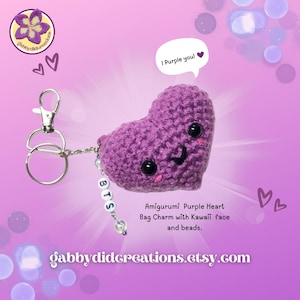 May include: Purple crocheted heart-shaped bag charm with a kawaii face and beads. The charm is attached to a silver key ring with a silver chain and a charm that says "BTS".