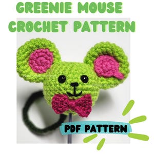 May include: A crochet pattern for a greenie mouse with pink ears and a pink bow tie. The pattern is available as a PDF download.  PDF PATTERN