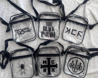 May include: Six clear plastic crossbody bags with black trim and adjustable straps. Each bag features a unique black graphic print: My Chemical Romance logo, The Black Parade text, MCR initials, a spider, a cross, and a circular MCR emblem.
