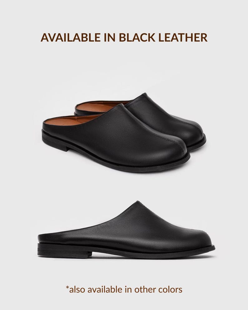 May include: Black leather mules featuring a smooth finish, a rounded toe, and a low heel. The text AVAILABLE IN BLACK LEATHER is displayed at the top, and the text *also available in other colours is displayed at the bottom of the image.