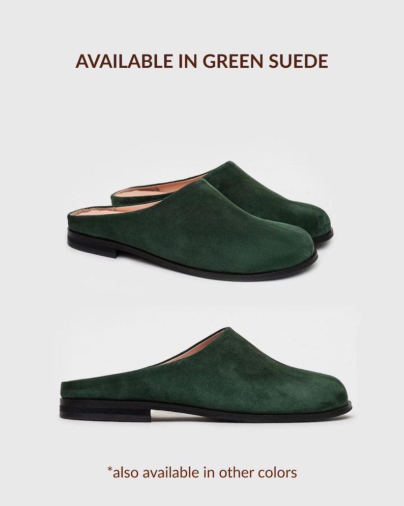 May include: A pair of dark green suede mules with a closed rounded toe and a low black heel. The interior lining is a light beige colour. The text "AVAILABLE IN GREEN SUEDE" is printed above the shoes, and "*also available in other colours" is below.