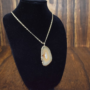 Gold Tone Necklace with Elongated Brown Stone Pendant