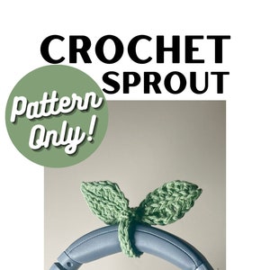 May include: Crochet pattern for a green sprout headband for headphones. The pattern is available for purchase on Etsy at ETSY.COM/SHOP/FWKCUSTOMS.