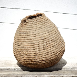 Old basket, burgundy straw and bramble, woven basket, interior decoration, pantry, plant pot, woven basket