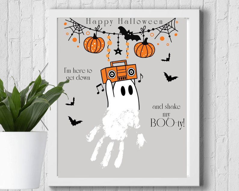 May include: A gray and white printable Halloween sign with a ghost holding a boombox and the text "Happy Halloween, I'm here to get down and shake my BOO-ty!"