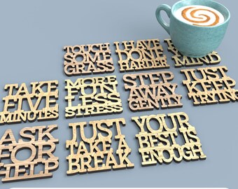 May include: Wooden laser-cut coasters with inspirational phrases like "Take Five Minutes" and "Your Best Is Enough." A teal mug with a latte sits on top of the coasters. The bottom of the image reads "DIGITAL FILE FOR LASER CUTTING."