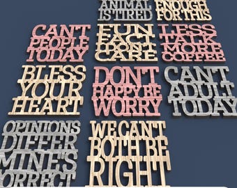 May include: A collection of laser-cut wooden signs with various motivational phrases, including "My Spirit Is Tired" and "Can't Adult Today." The signs are in different colors and fonts, with the words cut out. The bottom of the image reads "Digital File For Laser Cutting."