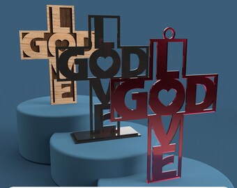 May include: Three wooden crosses with the words "I Love God" cut out. The crosses are in different colors: natural wood, black, and red.