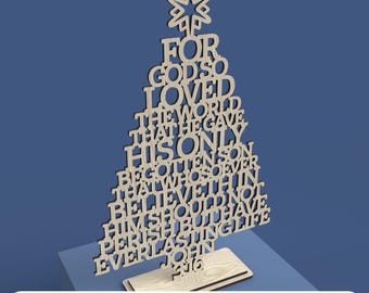 May include: A wooden Christmas tree cutout with the words "For God so loved the world that he gave his only begotten Son that whosoever believeth in him should not perish but have everlasting life John 3:16"