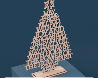 May include: A wooden Christmas tree cutout with the words "May the God of hope fill you with all joy and peace as you trust in him so that you may overflow with hope by the power of the Holy Spirit Romans 15:13"