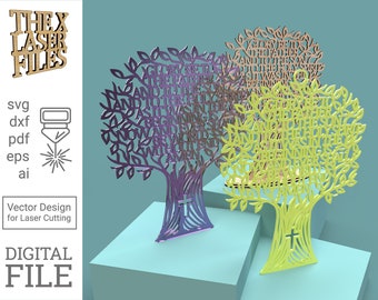 May include: Two laser cut wooden tree designs with the words "Glory be to the Father and to the Son and to the Holy Spirit as it was in the beginning is now and ever shall be world without end Amen" in the branches. The trees are purple and green.