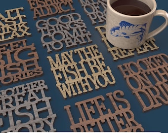 May include: Wooden coasters with fishing-themed phrases like "Certified Fishing Addict" and "May the Fish Be With You." A mug with a fish graphic sits among the coasters. The phrase "Digital File for Laser Cutting" is at the bottom.