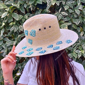 Mexican straw hat with eye decoration