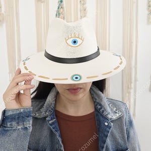 Mexican straw hat with hand painted eye decoration