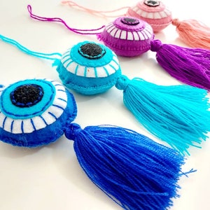 Round evil eye tassel