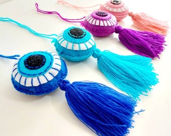Round evil eye tassel