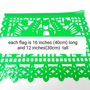May include: Green paper party banner with a cut-out design of flowers and birds. Each flag is 16 inches (40 cm) long and 12 inches (30 cm) tall.