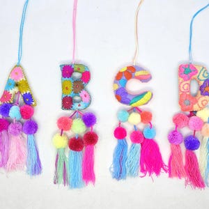 Embroidered Christmas Letter Ornament: Pastel Mexican Decor with Tassels