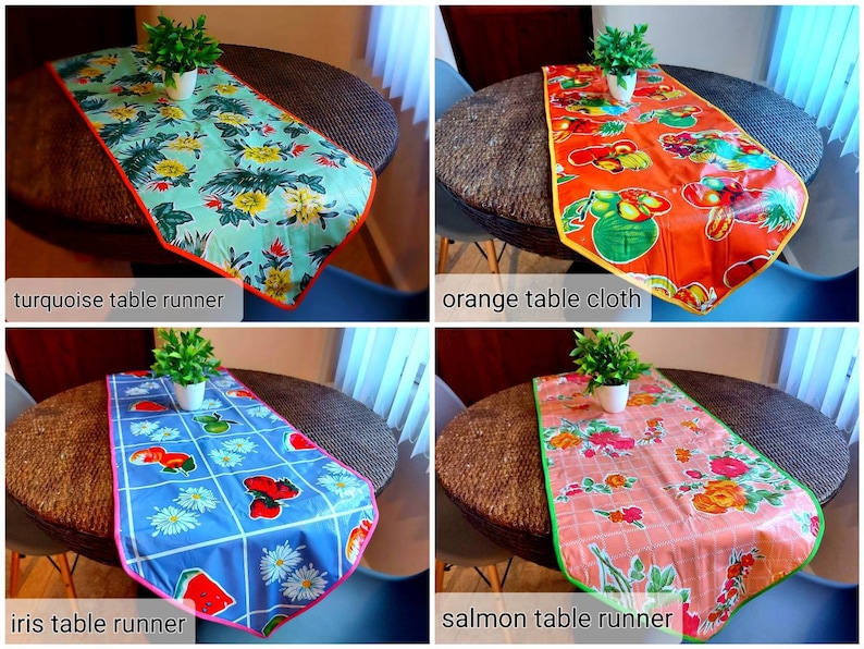 May include: Four table runners in different colors and patterns. The table runners are turquoise with tropical leaves and flowers, orange with fruit, blue with watermelons and daisies, and salmon with pink roses and green leaves.  The table runners are all on a brown wicker table.