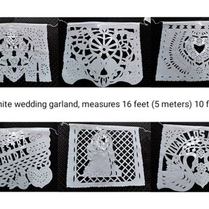 May include: White paper wedding garland with 10 flags, each with a different design. The garland measures 16 feet (5 meters) long.