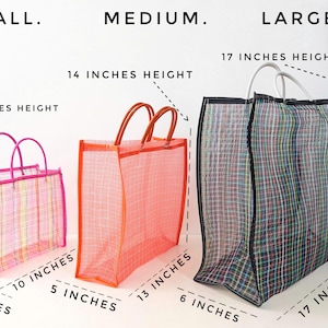 May include: Three rectangular mesh tote bags in small, medium, and large sizes. The small bag is pink with 9 inches height, 10 inches width, 4 inches depth. The medium is orange with 14 inches height, 13 inches width, 5 inches depth. The large is black with 17 inches height, 17 inches width, 6 inches depth.