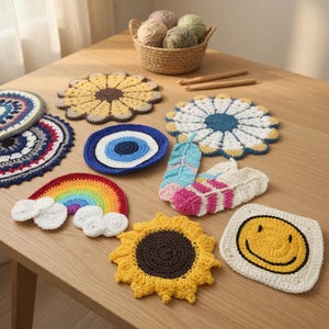 May include: A collection of assorted crochet coasters featuring various designs including a rainbow with clouds, sunflowers, a smiley face, an evil eye, and feather shapes, alongside a woven basket containing several balls of yarn and two hooks.