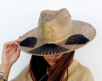 Golden straw hat with embroidered decoration