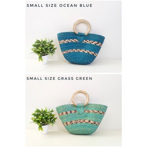 May include: Two small woven bags with round handles. The top bag is ocean blue with horizontal brown and tan patterned stripes. The bottom bag is grass green with similar horizontal brown and tan patterned stripes. Both bags feature text labels.
