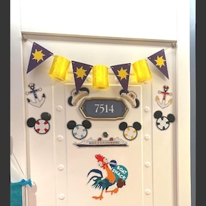May include: A white door decorated with a purple and yellow sun bunting, a sign reading 7514, two anchors, two life preserver Mickey Mouse icons, a cruise ship graphic, and a cartoon rooster sticker with the text BOK! BOAT SNACK.