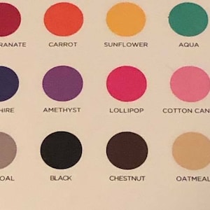 May include: A colour chart with 15 different paint swatches. The swatches are labelled with the following names: Crimson, Pomegranate, Carrot, Sunflower, Aqua, Grass, Peacock, Sapphire, Amethyst, Lollipop, Cotton Candy, Cream, White, Charcoal, Black, Chestnut, Oatmeal.
