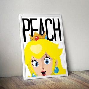 May include: A white framed print with a cartoon image of Princess Peach from the Super Mario video game series. The image is a close-up of her face and the text "PEACH" is printed in black above her head.
