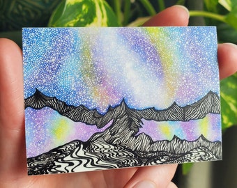 May include: A hand-drawn illustration of a mountain range with a starry night sky above. The sky is a gradient of blue, purple, and yellow with white dots representing stars. The mountains are black with white lines representing the peaks and valleys. The illustration is done in a detailed and intricate style.