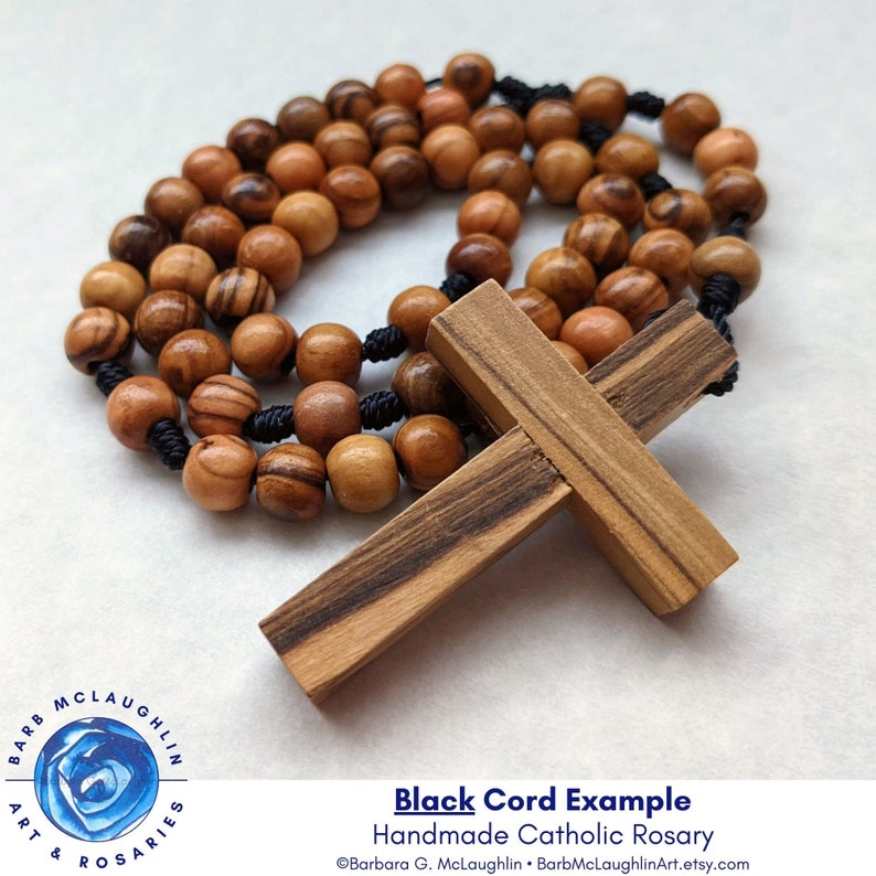 Handmade wood rosary with movable 7mm authentic Holy Land olive wood beads, simple wooden cross, and black nylon cord. This five decade rosary makes a great Catholic gift for First Communion, Confirmation, or other special occasions.